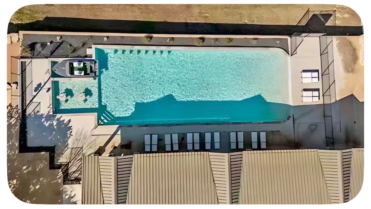 Aerial view of the pool and boat dock