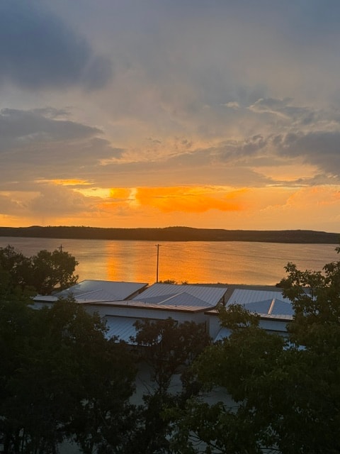 Lakeside porch with grill and sunset views